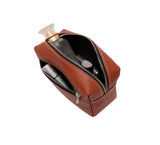 Leather Wrist Bag from Rydal in 'Rust' showing contents.