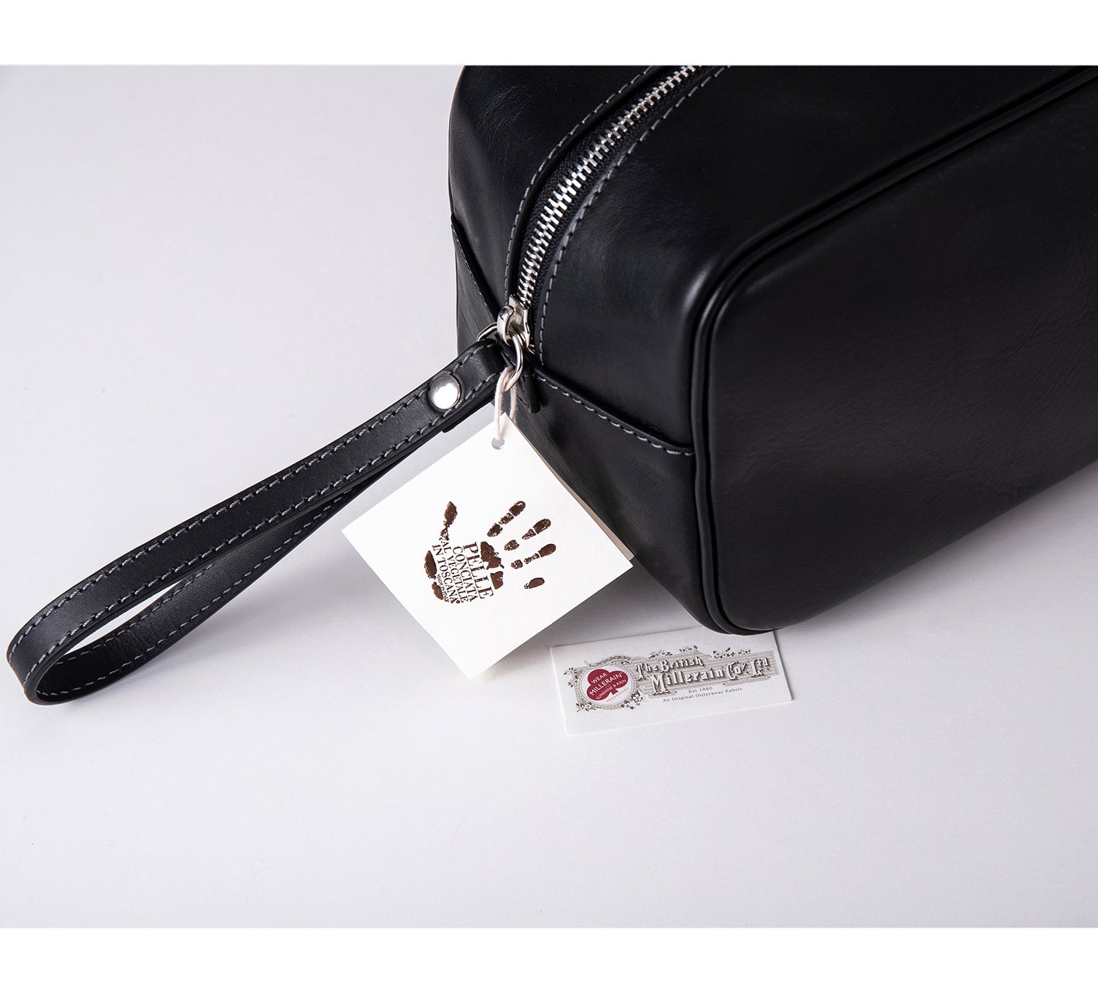 Mens Leather Wash Bag from Rydal in 'Black' showing Guarantee Labels.