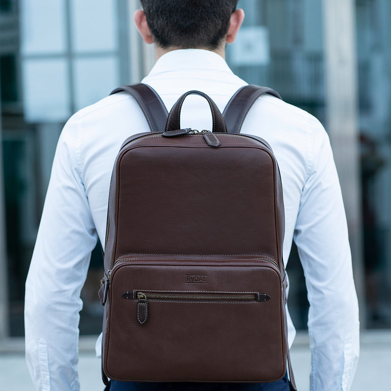 Model wearing the Henley Mens Leather Backpack from Rydal in 'Dark Brown'.