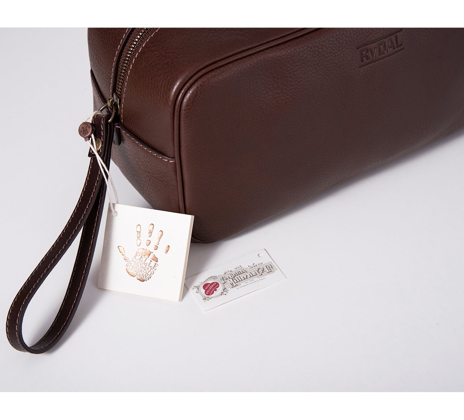 Mens Leather Wash Bag from Rydal in 'Dark Brown' showing Guarantee Labels.